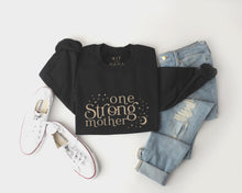 Load image into Gallery viewer, one strong mother celestial black sweater with beige design
