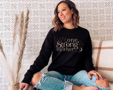 Load image into Gallery viewer, one strong mother celestial black sweater with beige design
