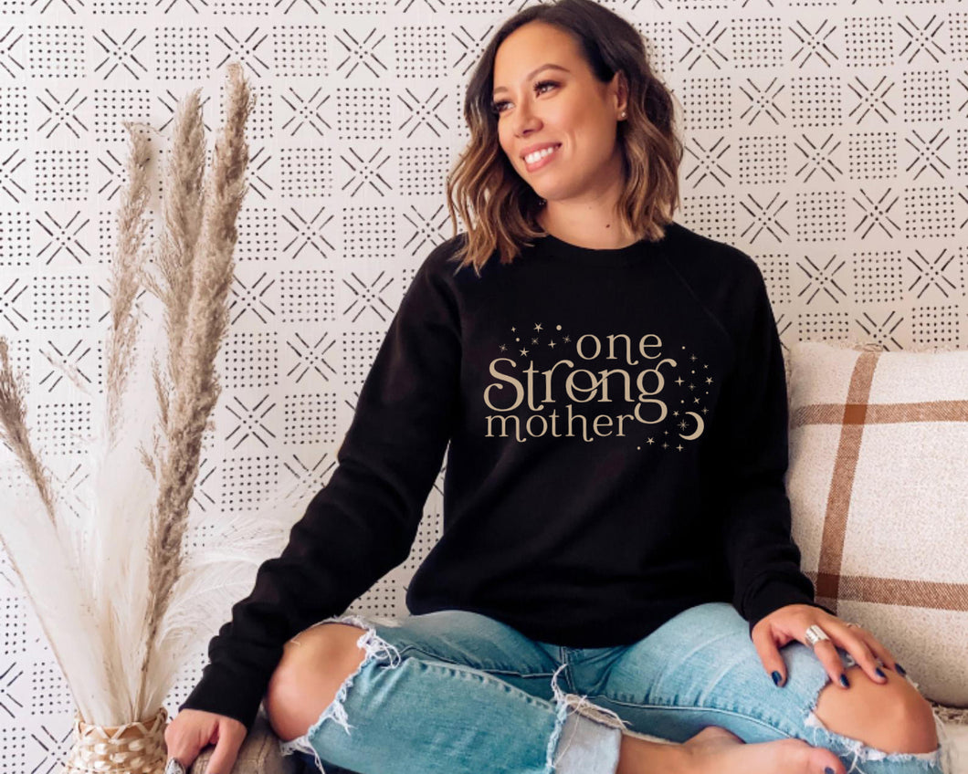 one strong mother celestial black sweater with beige design